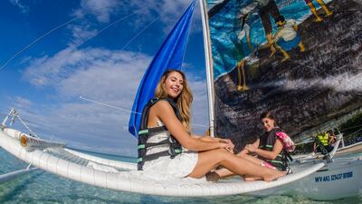 Tourists ride on a bangka on Boracay. EPA