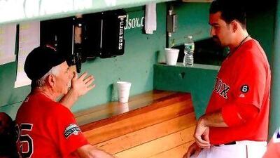 Bobby Valentine, left, has a discussion with Adrian Gonzalez, one of the players cited in reports as among a group that asked for Valentine's ouster from the manager's job. Instead it is Gonzalez and a group of others heading west to the Los Angeles Dodgers as the Red Sox dump salary to make way for the future.