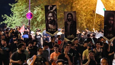 Followers of Iraqi Shiite cleric Moqtada al-Sadr protest on Tahrir Square near Baghdad's Green Zone a day after an alleged burning of the Qoran in Copenhagen, early on July 22, 2023. (Photo by Murtaja LATEEF / AFP)