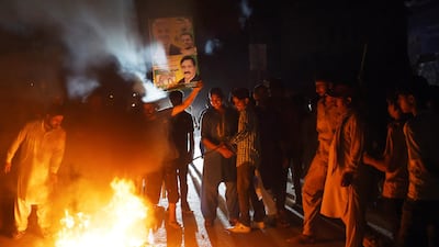 Supporters of former Pakistani Prime Minister Nawaz Sharif burn tyres during a protest ahead of of the arrival of Nawaz from London, in a rally in Lahore. AFP