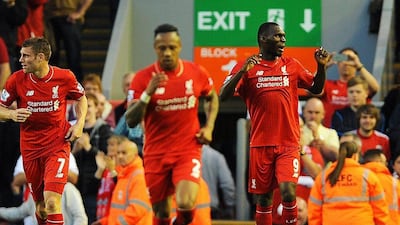 Christian Benteke, right, celebrates scoring his first goal for Liverpool in the 1-0 win over Bournemouth. Peter Powell / EPA