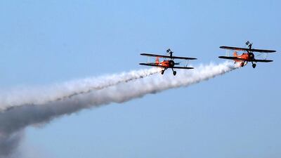The wingwalkers perform at the Dubai Airshow. AFP