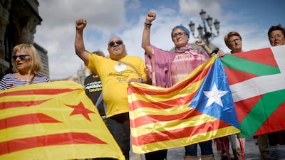 Protesters carry Esteladas, Catalan separatist flags, and Basque flags, during a rally in favour of a referendum on independence from Spain for the autonomous community of Catalonia, in the Basque city of Bilbao, Spain. REUTERS/Vincent West