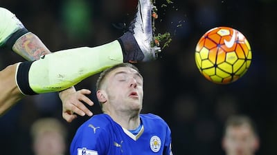 Leicester City’s Jamie Vardy winces as Manchester City’s Nicolas Otamendi, partially pictured kicks the ball. Darren Staples / Reuters