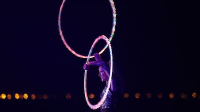 A woman plays with a hula hoop during a party in the Saudi Red Sea resort.
