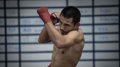 World Boxing Council (WBC) mini-flyweight champion, Wanheng Menayothin, warming up during a training session in Bangkok. Lillian Suwanrumpha / AFP