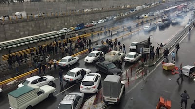 People stop their cars on a road in Tehran, Iran, on November 16, 2019 in protest against fuel price rises . Wana