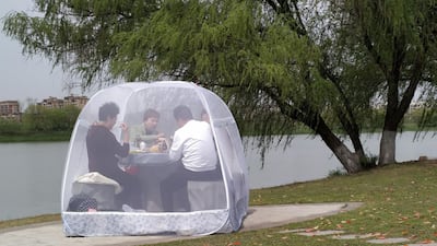 People enjoy a meal inside a tent, at a park in Nanjing, Jiangsu province, China. Reuters