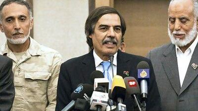 Dr Ali Tarhouni, the rebels' oil minister, at a news conference in Tripoli. Giulio Petrocco / AP Photo