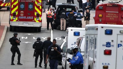 Emergency vehicles and police respond to a reported shooting at an entrance to the Washington Navy Yard on Monday. Alex Wong / Getty Images / AFP