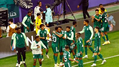 Saudi Arabia's Abdullah Radif celebrates scoring with teammates. Reuters