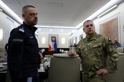 Gen Wieslaw Kukula of the Polish Armed Forces, right, and chief of police Marek Boron in Warsaw for an extraordinary government meeting following Russia's violation of Polish airspace. Reuters