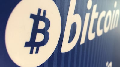 A Bitcoin logo on a cryptocurrency ATM in Santa Monica, California. Digital currency has fallen 15 per cent since Friday. Reuters