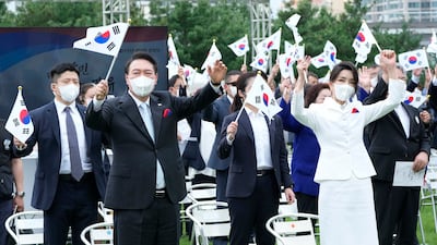Yoon and Kim cheer during South Korea's 77th National Liberation Day celebrations in Seoul, in August 2022. Getty