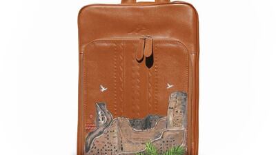A leather bag by Qormuz painted with a scene of Saudi Arabia. Photo: Qormuz
