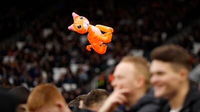 An inflatable cat is thrown from the stands on Saturday. Reuters