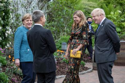 Carrie Johnson wore rented outfits to a series of G7 Summit events. Courtesy AFP