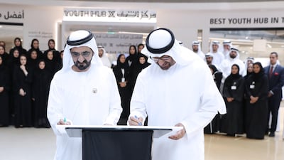 Sheikh Mohammed bin Rashid and Sheikh Mohammed bin Zayed sign a plaque inaugurating the Youth Hub. Wam