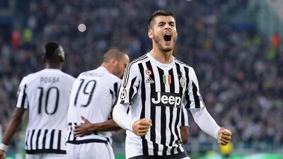 Juventus forward Alvaro Morata celebrates scoring the opening goal in their 2-0 Champions league win over Sevilla on Wednesday night. Alessandro Di Marco / EPA / September 30, 2015