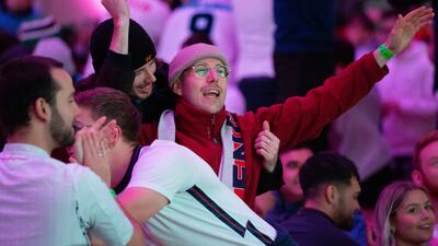 Fans celebrate in Manchester as England score in the Fifa World Cup match against Iran in Doha. England romped to a 6-2 victory. EPA