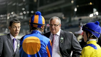 South African trainer Mike De Kock, centre, has 12 runners across seven races on Saturday at Meydan Racecourse while Godolphin trainer Saeed Bin Suroor has only eight. Francois Nel / Getty Images