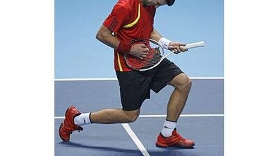 Novak Djokovic "performs" after taking a point against Rafael Nadal at the ATP World Tour Finals in London.