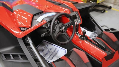 Polaris introduced the Slingshot, above, a two-seat, three-wheeler motorcycle priced at about $20,000 to $24,000. Scott Olson / Getty Images / AFP