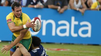 Brazil’s Martin Schaefer, left, looks to pass as France’s Julien Candelon tackles him during their match at the Dubai Rugby Sevens, which served as a leg of the Sevens World Series. The top four nations at the end of the series will qualify for the Rio 2016 Olympics. Karim Sahib / AFP