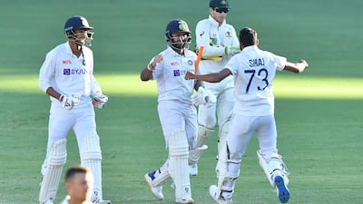 Rishabh Pant celebrates with teammates after India win the fourth Test and the series against Australia. EPA