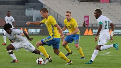 Ivory Coast, in white, defeated Sweden 2-1 in Abu Dhabi. Karim Sahib / AFP