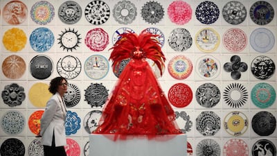 Guests look at the work entitled 'Circumference' by Rene Trevino at the Erin Cluley Gallery at the Frieze London 2025 exhibition. AFP