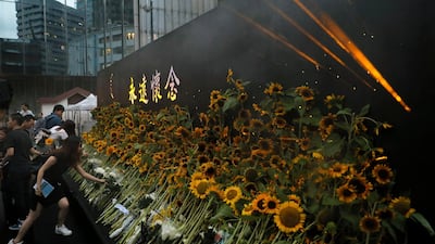 Attendees take part in a public memorial for Marco Leung, the 35-year-old man who fell to his death weeks ago after hanging a protest banner against an extradition bill, in Hong Kong. AP Photo
