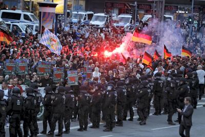 Right-wing demonstrators light flares on August 27, 2018 in Chemnitz, eastern Germany. AFP Photo
