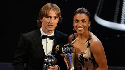 Real Madrid player Luka Modric (L) with the Best FIFA Men's Player award and Brazilian international Marta with the Best FIFA Women's Player award pose during the Best FIFA Football Awards 2018 in London. EPA