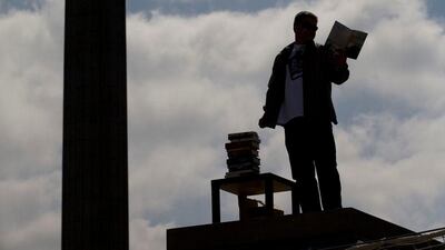 Graham Fudger, atop the fourth plinth in Trafalgar Square, reads excerpts from the 13 books longlisted for this year's Man Booker Pirze.