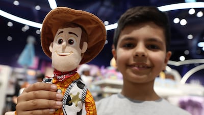 Jad Al Eissa, nine, holds a plush doll of Woody from Toy Story