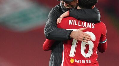 Juegen Klopp celebrates with Neco Williams after the match. Reuters