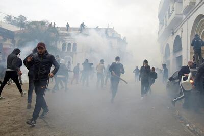 People clash with anti-riot police during the protest against President Abdelaziz Bouteflika in Algiers. Reuters