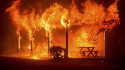 A house burns as the Butte fire rages through Mountain Ranch, California. Evacuation orders were expanded to thousands of homes in northern California’s Sierras on Friday as the rapidly spreading wildfire roared for a third day through drought-parched timber and brush, threatening mountain communities. Noah Berger / Reuters