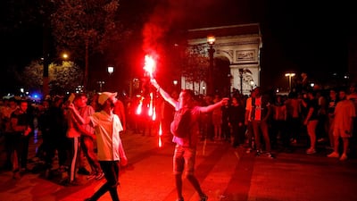 Paris Saint-Germain supporters celebrate their team's 3-0 win over RB Leipzig on the Champs-Elysees. AFP