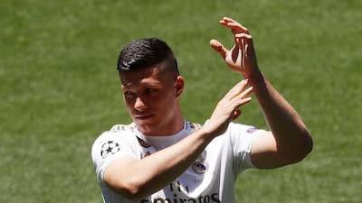 Luka Jovic applauds the crowd inside the Santiago Bernabeu during his unveiling.