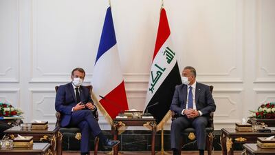 French President Emmanuel Macron (L) meets Iraq's Prime Minister Mustafa Al Kadhimi in Iraq's capital Baghdad on September 2. AFP