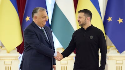 Ukrainian President Volodymyr Zelenskyy, right, welcomes Hungarian Prime Minister Viktor Orban to Kyiv on Tuesday. AP