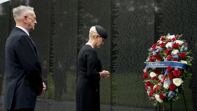 Cindy McCain, wife of John McCain, accompanied by defence secretary Jim Mattis lays a wreath at the Vietnam Veterans Memorial in Washington. AP