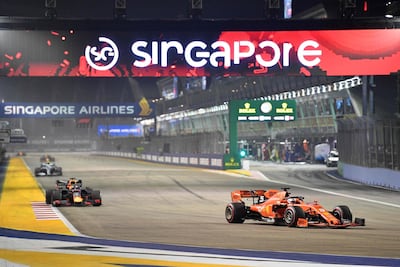Sebastian Vettel, right, secured his fifth win in Singapore. AFP