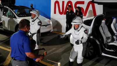 Nasa astronaut Megan McArthur gave her son, Theodore Behnken and husband, Bob Behnken who is also an astronaut, a virtual hug as she arrived. Reuters