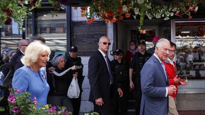 Britain's Prince Charles and Camilla, Duchess of Cornwall walk along a street, on the second day of the Canadian 2022 Royal Tour, in Ottawa. Reuters