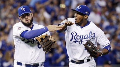 Alcides Escobar, right, is the first player to lead off four straight games in a postseason series with a hit, earning him MVP of the ALCS. Charlie Riedel / AP Photo