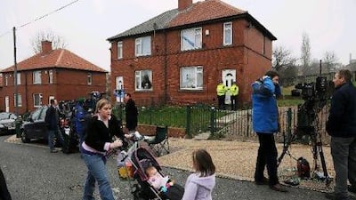 Police officers guard the home of Shannon Matthews, 9, from Moorside Road, Dewsbury, West Yorkshire, who was found alive 24 days after she disappeared on her way home from school in 2008. PA Archive