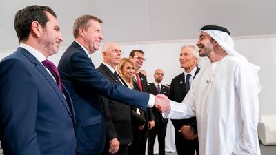 Sheikh Abdullah bin Zayed meets with guests at the exhibition opening.